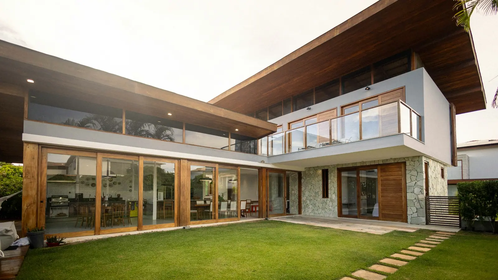 Illustrative photo of a contemporary home opening onto a landscaped garden.